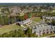 Expansive aerial view of a townhome community nestled amidst lakes and mature trees, radiating natural beauty at 822 Foxtail Dr. # 822, Longs, SC 29568