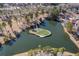Unique aerial view of an island putting green on a lake, adding a touch of luxury and recreational fun at 822 Foxtail Dr. # 822, Longs, SC 29568