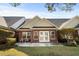 Charming backyard with a brick facade, patio, and manicured lawn perfect for outdoor enjoyment at 822 Foxtail Dr. # 822, Longs, SC 29568
