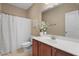 Bright bathroom featuring a white sink, toilet, and shower curtain at 822 Foxtail Dr. # 822, Longs, SC 29568
