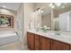 Bathroom with double sink vanity, bathtub, and decorative wall art at 822 Foxtail Dr. # 822, Longs, SC 29568