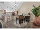 Open dining area with a chandelier and access to the kitchen at 822 Foxtail Dr. # 822, Longs, SC 29568