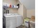Efficient laundry area with a washer, dryer, and shelving for optimal organization and convenience at 822 Foxtail Dr. # 822, Longs, SC 29568
