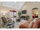 Bright and airy living room with vaulted ceilings, fireplace, and access to outdoor space at 822 Foxtail Dr. # 822, Longs, SC 29568
