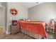 Cozy bedroom with warm colors, offering a comforting retreat with a decorative wreath at 900 Pelagic Loop, Myrtle Beach, SC 29579