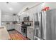 Charming kitchen with stainless steel appliances, granite countertops, and gray cabinets offers modern appeal at 900 Pelagic Loop, Myrtle Beach, SC 29579