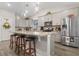 Modern kitchen featuring an island with seating, stainless steel appliances, and stylish pendant lighting at 900 Pelagic Loop, Myrtle Beach, SC 29579