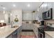 Well-equipped kitchen with granite countertops, stainless steel appliances, and a convenient island with double sinks at 900 Pelagic Loop, Myrtle Beach, SC 29579
