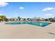 Community pool with ample lounge chairs and a clubhouse in the background at 900 Pelagic Loop, Myrtle Beach, SC 29579