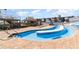 Beautiful outdoor pool area with a lazy river and a bar nearby at 9550 Shore Dr. # 231, Myrtle Beach, SC 29572