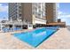 Spacious outdoor swimming pool surrounded by plenty of lounge chairs and umbrella tables at 9550 Shore Dr. # 231, Myrtle Beach, SC 29572