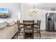 Cozy dining area with modern chandelier adjacent to kitchen, perfect for Gathering meals at 9754 Leyland Dr. # 11, Myrtle Beach, SC 29572