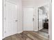 Tiled entryway showcasing three doors and modern finishes at 9754 Leyland Dr. # 11, Myrtle Beach, SC 29572