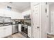 Well-lit kitchen with modern stainless-steel appliances and tiled backsplash at 9754 Leyland Dr. # 11, Myrtle Beach, SC 29572