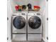 Efficient laundry area with stacked washer and dryer units in a closet at 9754 Leyland Dr. # 11, Myrtle Beach, SC 29572