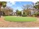 Putting green amid mature trees, with condo buildings in the background at 9754 Leyland Dr. # 11, Myrtle Beach, SC 29572