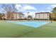 A view of green and blue tennis courts with condo buildings in the background at 9754 Leyland Dr. # 11, Myrtle Beach, SC 29572