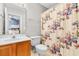 Bathroom featuring a single sink, floral shower curtain, and a mirror at 1202 Formby Ct., Myrtle Beach, SC 29588