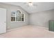 Bedroom featuring neutral walls, carpet floors, and a large window at 1202 Formby Ct., Myrtle Beach, SC 29588