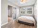 Bedroom featuring neutral walls, laminate floors, and a sliding glass door to the living room at 1202 Formby Ct., Myrtle Beach, SC 29588