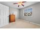 Bedroom with neutral walls and carpet with a window providing natural light and a ceiling fan at 1202 Formby Ct., Myrtle Beach, SC 29588