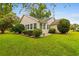 Charming single-story home with manicured lawn and mature landscaping, offering great curb appeal and outdoor enjoyment at 1202 Formby Ct., Myrtle Beach, SC 29588