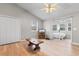 Cozy living room featuring vaulted ceilings, a ceiling fan, and sliding glass doors at 1202 Formby Ct., Myrtle Beach, SC 29588
