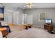 Living room featuring vaulted ceilings, a ceiling fan, wood floors and access to the kitchen at 1202 Formby Ct., Myrtle Beach, SC 29588