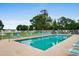 This beautiful outdoor swimming pool with inviting blue lounge chairs is the perfect spot for summer relaxation at 1202 Formby Ct., Myrtle Beach, SC 29588