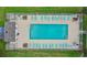 An aerial view of a community pool with plenty of lounge chairs and amenities surrounded by green space at 1202 Formby Ct., Myrtle Beach, SC 29588