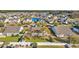 Aerial view of a neighborhood with homes surrounding a pond and lush green spaces at 133 Hartwell Dr., Little River, SC 29566