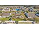 Aerial view of a neighborhood with homes surrounding a pond and lush green spaces at 133 Hartwell Dr., Little River, SC 29566