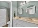 Well-lit bathroom featuring a double sink vanity and a shower-tub combo with a shower curtain at 133 Hartwell Dr., Little River, SC 29566