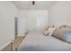 Comfortable bedroom with a metal bedframe, soft textures, and two entry doors at 133 Hartwell Dr., Little River, SC 29566