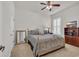 Inviting bedroom featuring a metal bedframe, ceiling fan, shuttered window, and ample natural light at 133 Hartwell Dr., Little River, SC 29566