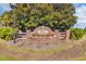 Lafayette Park brick sign with flowerbed and mature tree, creating a welcoming entrance at 133 Hartwell Dr., Little River, SC 29566