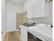 Bright laundry room features washer, dryer, ample storage and convenient access to the rest of the home at 133 Hartwell Dr., Little River, SC 29566