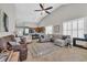 Spacious living room with vaulted ceiling, tile flooring, and view into kitchen at 133 Hartwell Dr., Little River, SC 29566