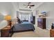 Well lit main bedroom with a large bed, ceiling fan, a bay window and ample storage at 133 Hartwell Dr., Little River, SC 29566