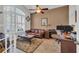 Cozy office featuring a leather sofa, desk, and natural light from a large window at 133 Hartwell Dr., Little River, SC 29566