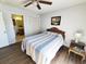Bedroom features ceiling fan, closet space, and access to the en-suite bathroom at 1356 Glenns Bay Rd. # 201B, Surfside Beach, SC 29575