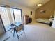 Bright bedroom with a private balcony, a dining table, and plenty of space at 1356 Glenns Bay Rd. # 201B, Surfside Beach, SC 29575