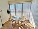 Dining area with glass table and vertical blinds at 1356 Glenns Bay Rd. # 201B, Surfside Beach, SC 29575