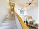 Inviting two-story foyer and staircase leading to upper level and a living area at 1356 Glenns Bay Rd. # 201B, Surfside Beach, SC 29575