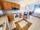 Open concept kitchen with eating area featuring cabinets and white appliances at 1356 Glenns Bay Rd. # 201B, Surfside Beach, SC 29575