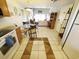 Open concept kitchen and living space has tile floor and access to outdoor living at 1356 Glenns Bay Rd. # 201B, Surfside Beach, SC 29575