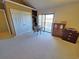 Another view of the bedroom with a high ceiling and a private balcony at 1356 Glenns Bay Rd. # 201B, Surfside Beach, SC 29575