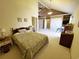 Large main bedroom with closet space, high ceiling, an ensuite bathroom, and a private balcony at 1356 Glenns Bay Rd. # 201B, Surfside Beach, SC 29575