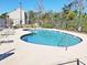 Community pool with a clean blue interior, surrounded by lounge chairs at 1356 Glenns Bay Rd. # 201B, Surfside Beach, SC 29575