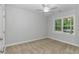 Neutral bedroom featuring carpet floors, large windows, and white trim at 19 Coventry Pl., Pawleys Island, SC 29585